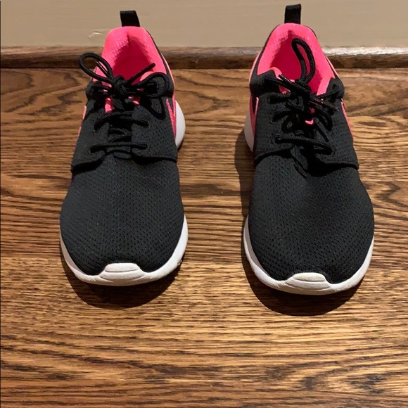 Black Nike Sneakers With A Pink Swoosh 